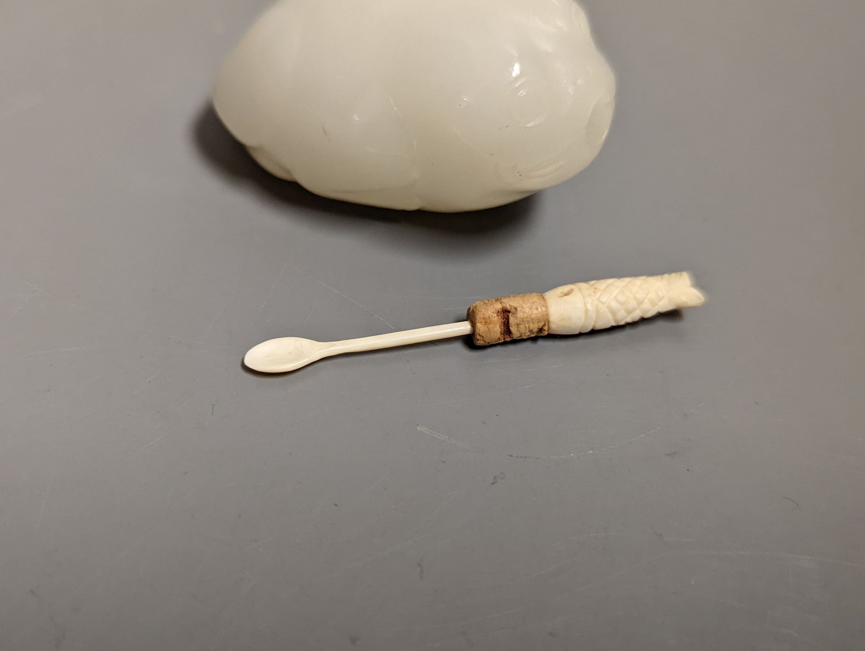 A Chinese white jade 'toad' snuff bottle, the stone of excellent even tone, 8cms long, including stopper